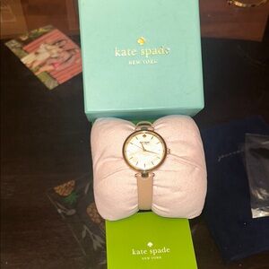 kate spade gold-tone watch with beige strap and mother-of-pearl dial